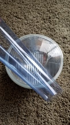 $6 headlight tint vinyl from Amazon. We'll see how long it lasts!