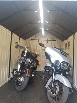 My bikes in their new home.  Floor is also resin and kind of soft, so need to put pucks under the kick stands,  will be installing some permanent steel plates so I wont have to fiddle with the pucks each time I park the bikes.
