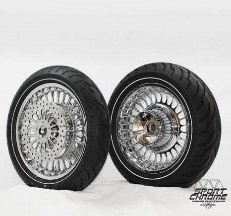 28 Spoke chrome wheels with matching discs, chrome rotor bolts and Dunlop American Elite narrow white wall tires.
