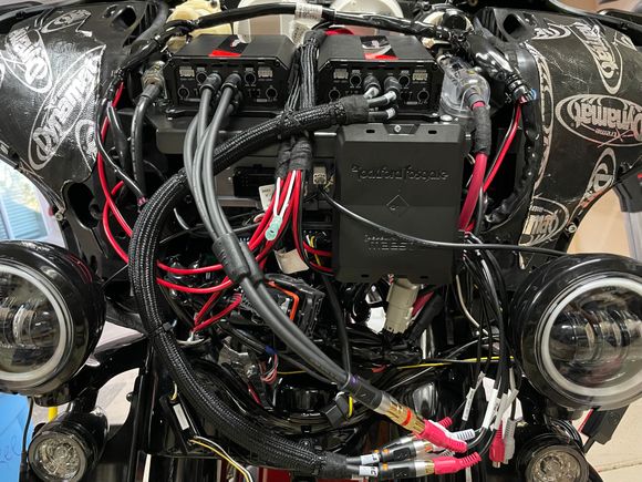 Got all the Harley cables tucked back and zip tied up. Wrapping all the audio cabling in wear resistant covering and zip tying it down. 
