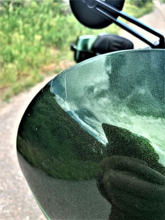 Right edge of fairing. A couple of fractures in the paint.