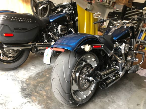 Anniversary 114 Fat Boy Kuryaken curved plate mounted vertical, custom dynamic LED tail lights with smoked lenses, & Rineharts Slip Ons.