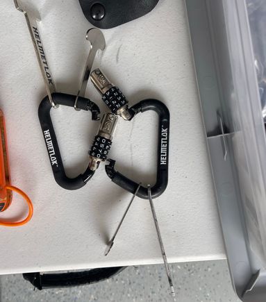 Helmet locks that attach to dring or latch. 