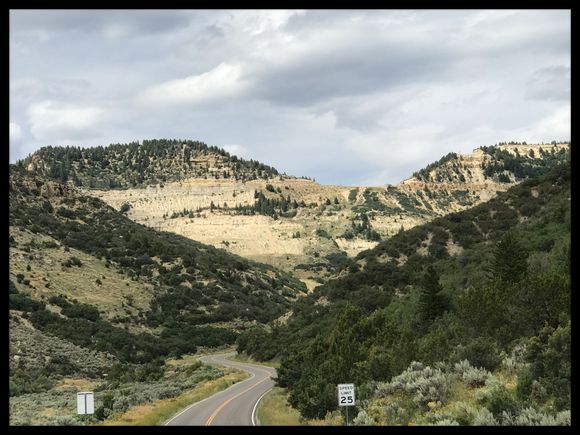 ....This is looking up at the pass, the road tops over at the saddle. Rod climbs up that face with several 15 mph switchbacks. It’s a very bumpy road so not really very good for crotch rockets, this is for taking your time. But very worthy the drive