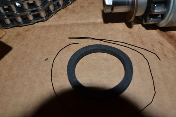 Where does this SS felt spacer go as it appears oversize to fit on outside of IP case between SS and case??  