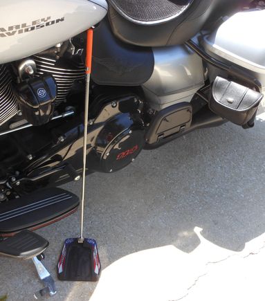I added pouches on each side that attach to the Saddlebag bars.  I keep my puck ing the left side one that I can reach with out getting off the bike.  The puck has a metal piece and the  colapsible wand has a magnet on the end that allows you to set or pick up the puck, again without getting off the bike.  $20 from Hardstreet at their booth during Daytona Bike Week (www.hardstreet.com).