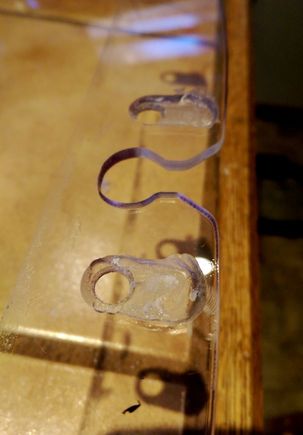 The routed sections make sure that the wires aren't squashed between the the windshield and inside of the fairing. I only put the holes there so there woudln't be anything where the wires make the bend where they come through the fairing.