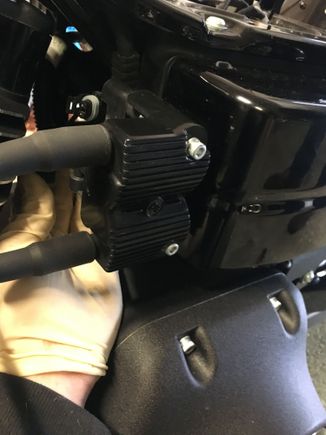 I removed the coil pack/plug wires cause it's easy and it gave me more room. There's a electrical connector that plugs in behind the coil to a plastic holder, don't know what the connector is for, but it is not used. It doesn't have to be removed. Only 2 Allen heads secure the coil pack. I removed the plugs to make it easier to rotate the crank.