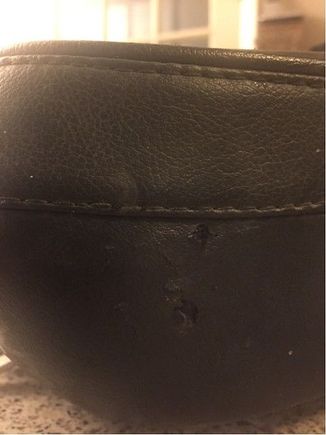 Rub marks/ small holes made by the back rest.