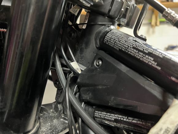 Wire going into bike where factory wires go in.  Tank is off.