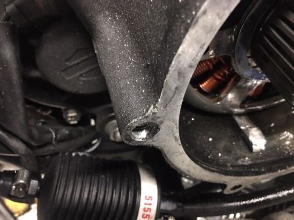 clutch piece jammed under the alternator.