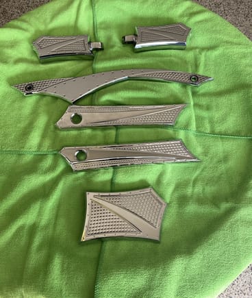 JC Choppers passenger pegs, brake pedal, shift linkage, and saddlebag hinge covers. Two shift pegs not pictured but are included in the sale (need to pick them up still)