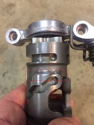 Shaved area (with dremel). Shift fork tracks in the "S" shaped groove and you are shaving just the back side upper lip. 
