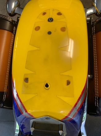 Under the chrome tailpiece.