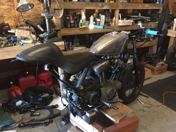 Ordered a cycle standard blackbird tank, antigravity battery, coil relocation kit from dk customs, 883 superlow split five spoke rear wheel, shinko 705 series tires in 110/80-r19 and 170/60-r17.  Already have renthal fat bars with joker machine bar mount, joker machine fork mounted speedo housing, joker machine bar end mirror, revival cycles clutch lever, nissin front brake master cylinder, biltwell whiskey throttle with a custom 7/8"-1"  throttle spacer, barnett idle and throttle cables, etc.