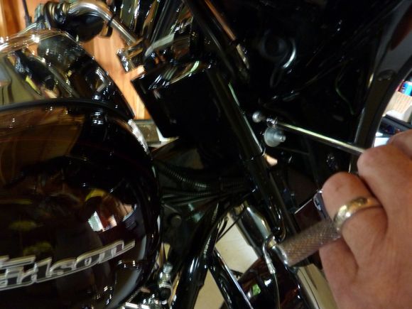Remove the two screws that secure the ignition switch housing.