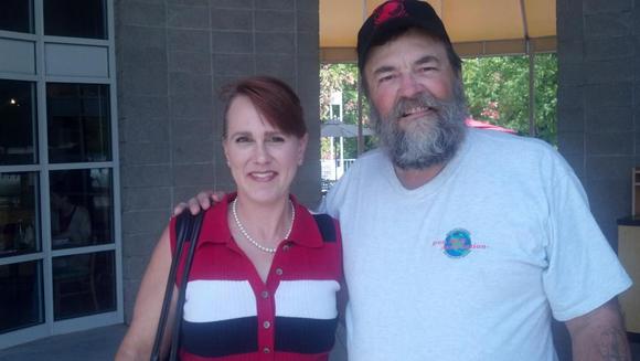 Karen and Sam a/k/a Chappy.  9.27.11 after having lunch at Gruby's Deli in Sandy Springs.  Just a fine man.