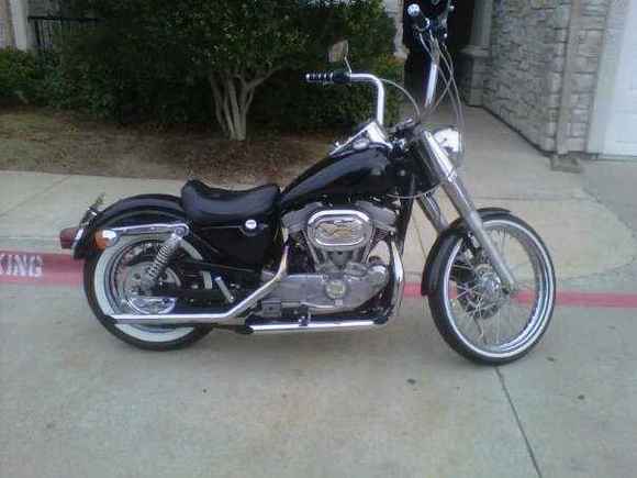 This is the Bike after I installed the Fat boy front end, 21 inch front wheel and white wall along with a 16 inch 80 spoke rear wheel and white wall. i also put a chrome rear pully cover on as well.