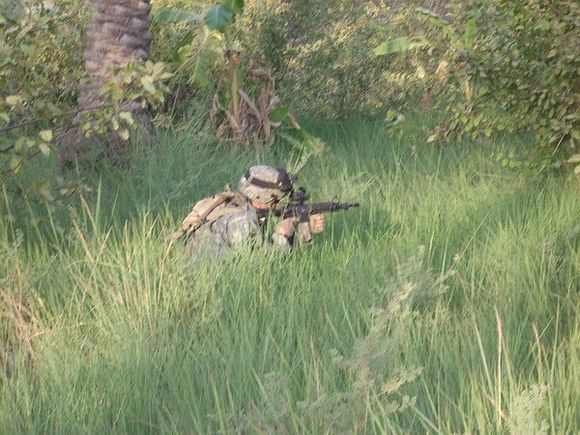 Reacting to sniper fire in the irrigation ditches of SW Baghdad
