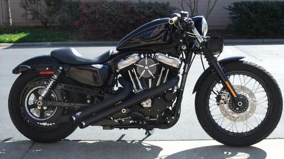 '09 Harley Nightster with V&amp;H Sideshots, RSD Venturi Air Filter, 32" drag bars, flat-black powdercoated primary panels, speedo-less bar clamp, relocated speedomoter.