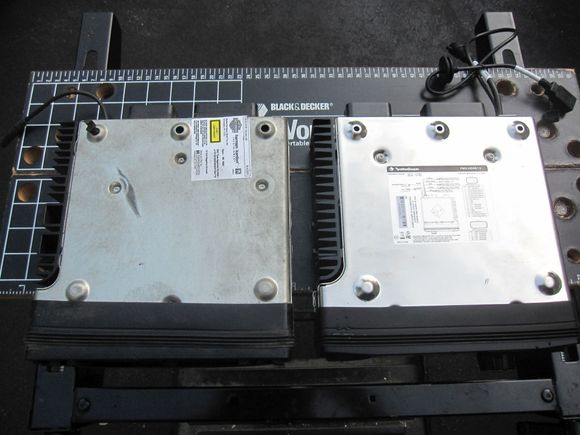 Both the PMX-HD9813 and the HD, bottom view. NOTE: difference in the size of the holes on the feet. Stock radio had a zip tie (HD part number: 10073 which is a "cable strap, rosebud mount"). This cable strap will not fit into the smaller hole on the RF radio