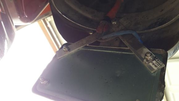 The 7/16 bolt with the wire strap is already there on the limited. I soldered and heat shrunk the wires for the led bolts. I used 2 6" x 3/16 x 1" pieces of aluminum to attach to the existing upper bolt to hold the plate frame.