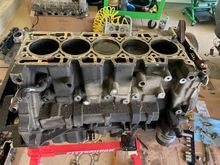 Head off, broken studs removed.  First glance, lot of carbon build up in the pistons.  