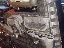 Installed custom tactical seat covers with built in storage.