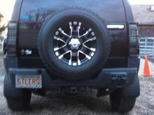 REAR VIEW, SPARE: 17X9 ULTRA WHEELS, BARON. MOUNTED ON 285/70R17 TOYO OPEN COUNTRY AT