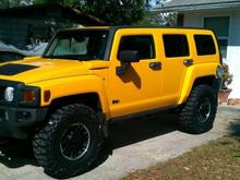 bed liner on the grille and mirrors and hella light covers. new 35 nitto mud grappler tires.