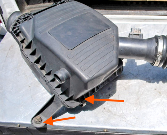 Coolant collecting in the well where you bolt the box to the engine bay as well as right above the front retainer clip closest to the radiator.