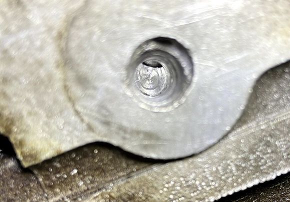 Manifold bolt hole – farthest towards the back by the firewall