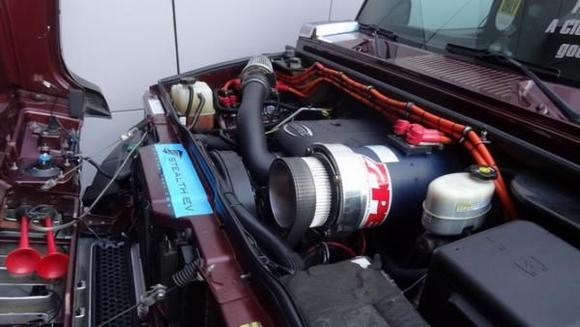 Viewing close up of hybrid motor at SEMA 2015 in Las Vegas