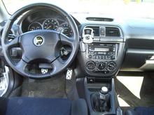 TWM shifter with custom boot since shifter is 2" shorter along with the 40% decrease in throw. Accesport mounted for easy viewing of realtime data