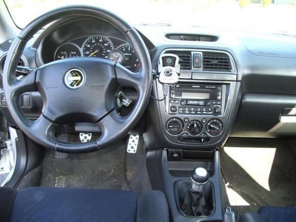 TWM shifter with custom boot since shifter is 2" shorter along with the 40% decrease in throw. Accesport mounted for easy viewing of realtime data