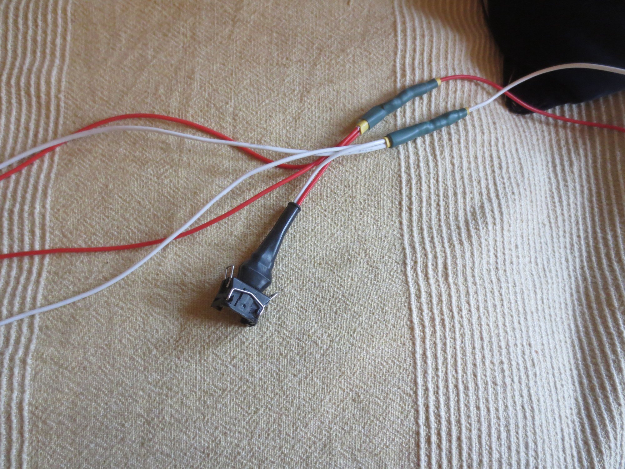 Close up showing one in and three out of the step down connector