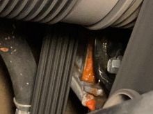 Sign of active coolant leak below the black front engine cover