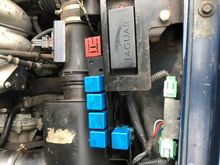 Hi, thanks for the very prompt reply - you can see from the pic that there are 4 relays + 1 below.  It looks like there is a red base and the pins do line up with the relay unit I bought.  Do you think this is missing?
My fan runs all the time and I think the previous owner bypassed the thermostatic circuit and wired always on.  Perhaps because the relays had failed?