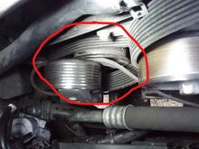 Supercharger tensioner pulley sits right in front (alternator?) pulley. No room for belt removal.