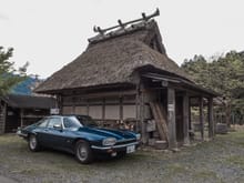 Okay, here's two shots. Another thatched building, more a storehouse than a farmhouse, however. Desaturated the image, then boosted the blues of the car.