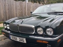 Polished up the chrome, put a neoprene gasket under the leaper to seal it better to the bonnet, and gave the car a (painfully intense) coat of hard carnuba wax.  Lot more work than some of the liquid and other formulations out there...but shines up nicely.  I think the VDP grille adds to the distinct  'face' of the car, no?