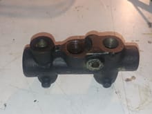 Brake balancing manifold (for lack of a better description).  It also has the brake failure switch mounted in it.