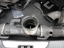 This is the condition of the inlet air tube where it connects to the throttle body. I don't know if the broken section pre-existed the independent changing the water pump or not.  I don't think they loosened the clamp at the throttle body until after trying to pull it off. I bought a replacement.