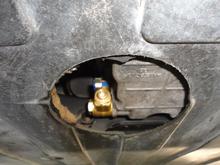Photo of Fumoto valve. You can push a short length of hose over the end to drain the oil and keep it out of the undertray.