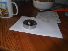 Machined spacer to get fan closer to the radiator; this distance is crucial to the fan's air-pulling power though the rad