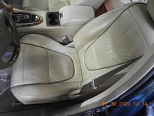 Looks like it's in the back seat but just the camera angle