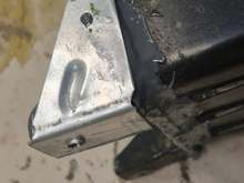 New mounting tab fabricated, and mating joints sealed. 