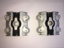 New Vee-mounts. Etch primed. Enamel top coat. New mounts are not coated because it inhibits the rubber bonding - strongly recommend extra protection before fitting.