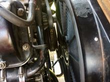 There's about an inch clearance there between the main pulley and the fan.