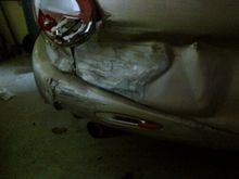 Note the side bumper, it went under the guard rail. Thank god someone invented the porta-power. This is 98% sheet metal damage.The other 2% are the light, trunk key area and the bumper cover.